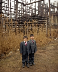 School boys in a refugee settlement at the abandoned gas processing factory. Bibi-Heybat. Baku, Azerbaijan (2008)