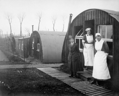 Commandant Johnson and two other women of the General Service Voluntary Aid Detachment (VAD) Motor Convoy outside Nissen Huts, Abbeville, France, 1919 � IWM (Q 8036)